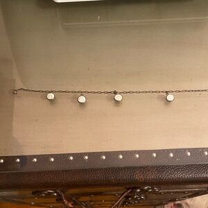 Ankle bracelet one charm needs reattached